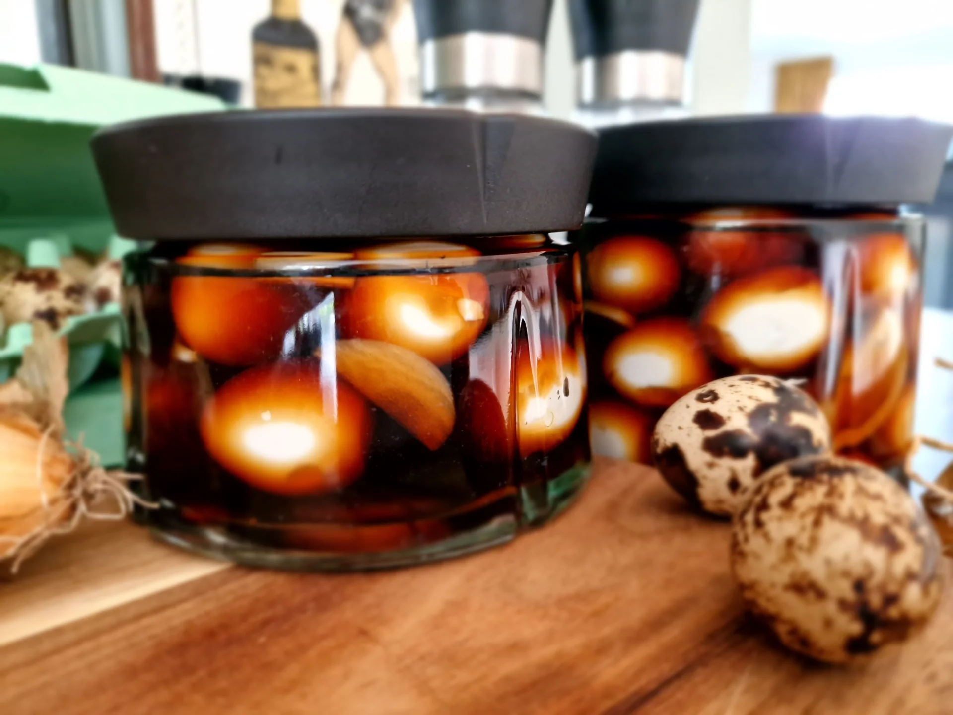 Teriyaki-marinated quail eggs in two small jars